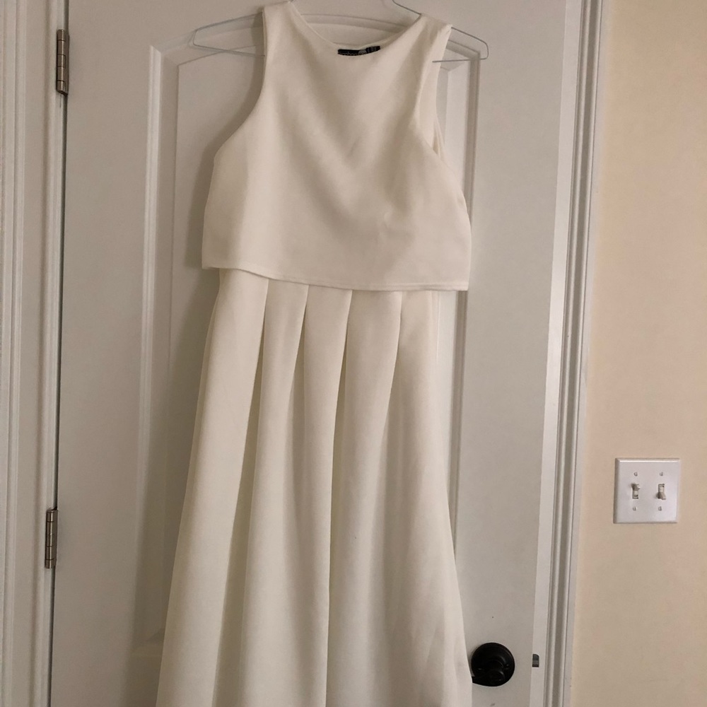 sleeveless white midi dress.